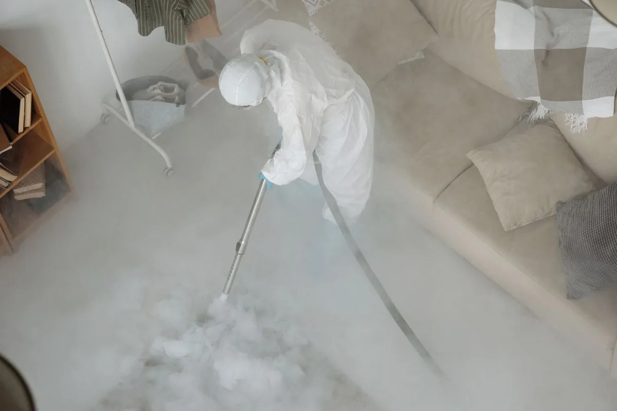 Biohazard cleanup technician in protective equipment, Sparta, GA